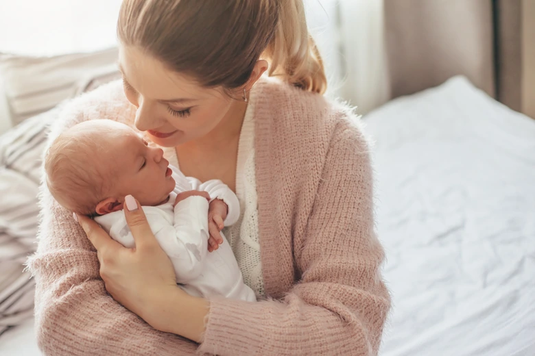 Mother holding newborn baby
